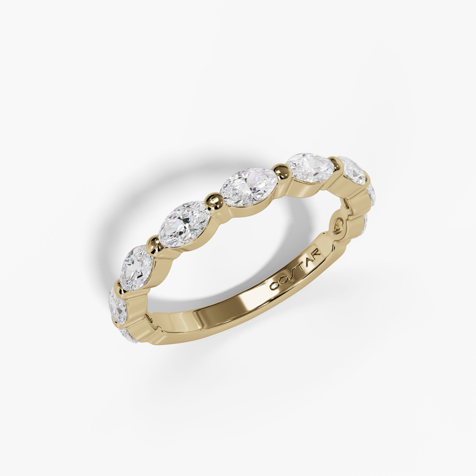 Yellow gold floating shared-prong marquise diamond band, angled view