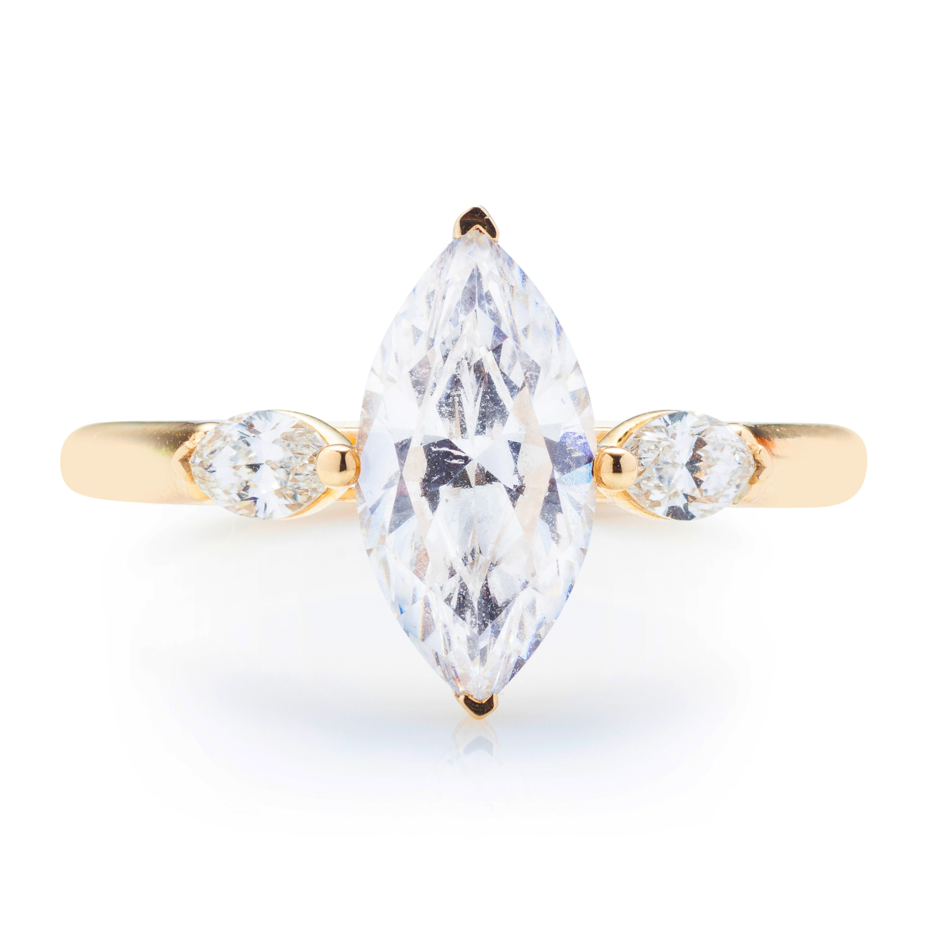 Marquise diamond yellow gold three-stone ring, front view