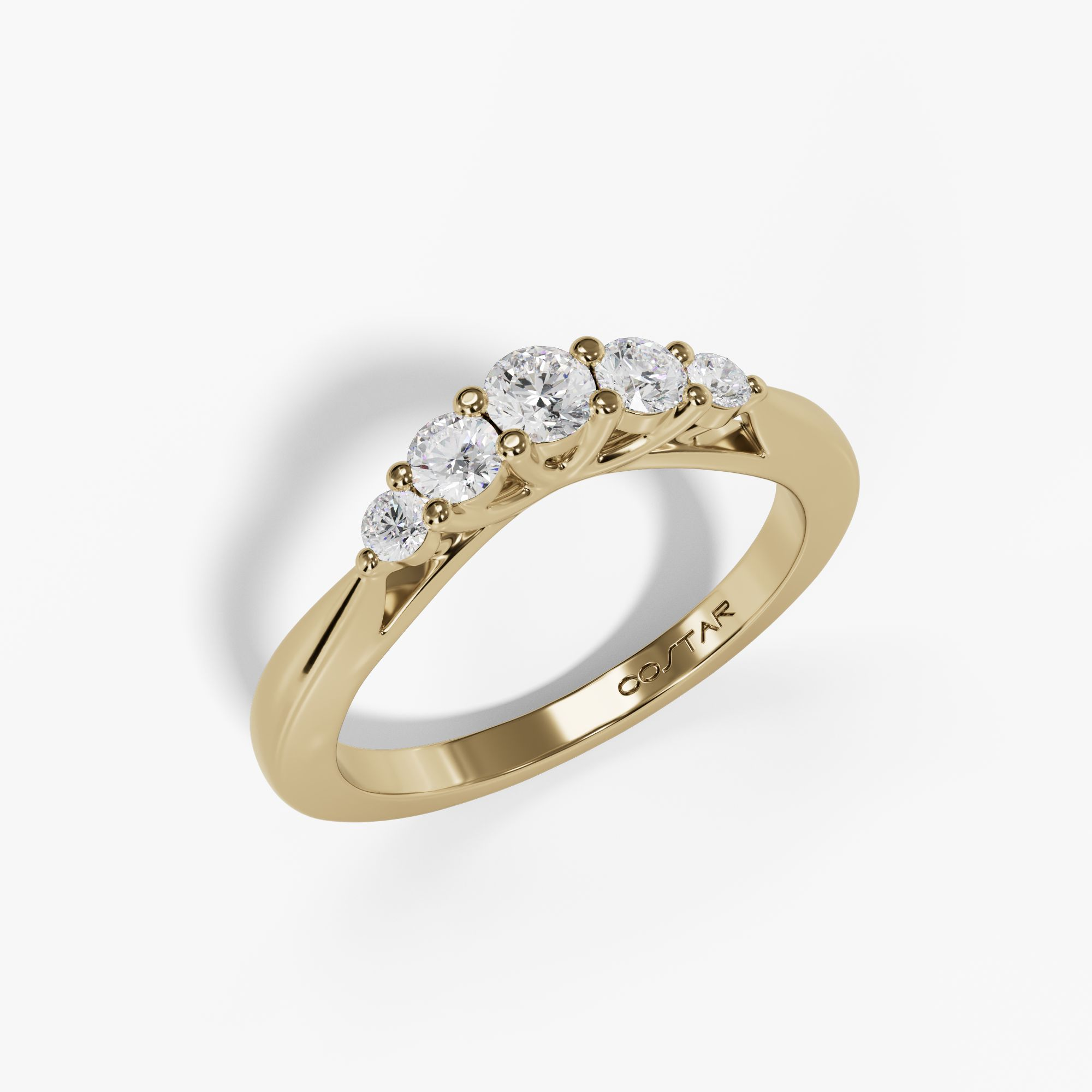 Curved graduated five-diamond band in yellow gold, angled view