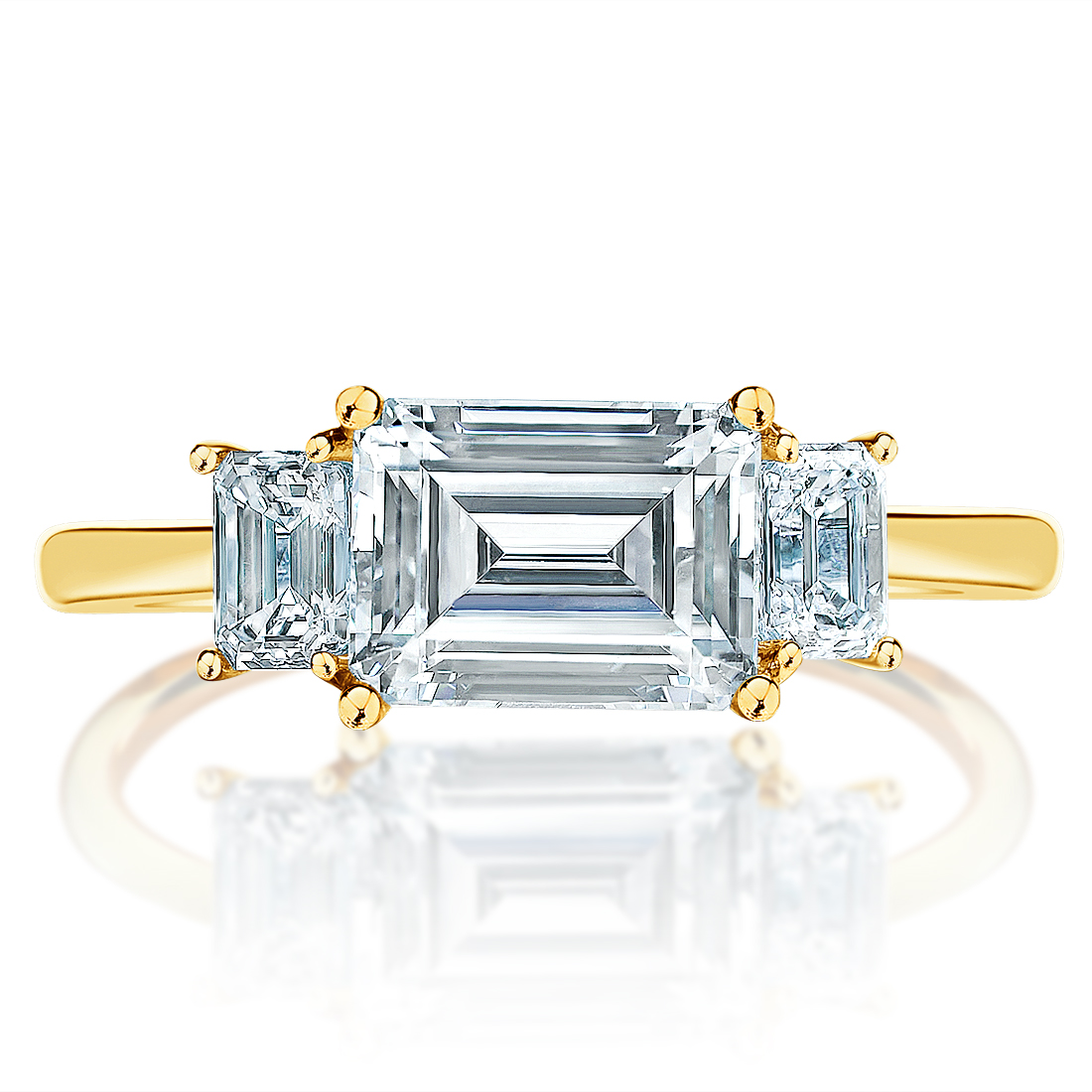 East-west emerald cut three-stone ring, front view