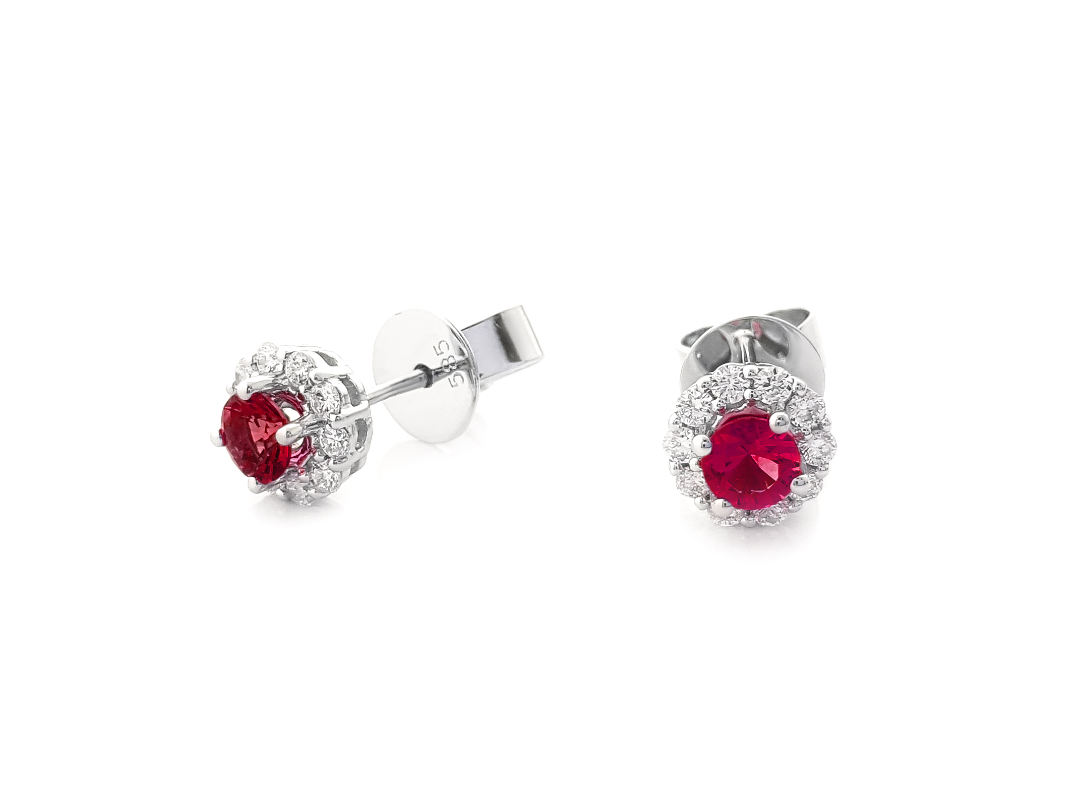 Ruby stud earrings with a natural diamond halo in 14K gold