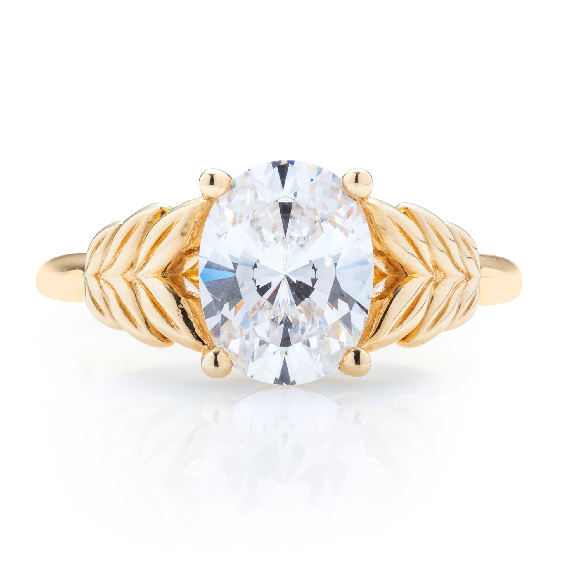 Oval diamond yellow gold solitaire with leaf motif, front view