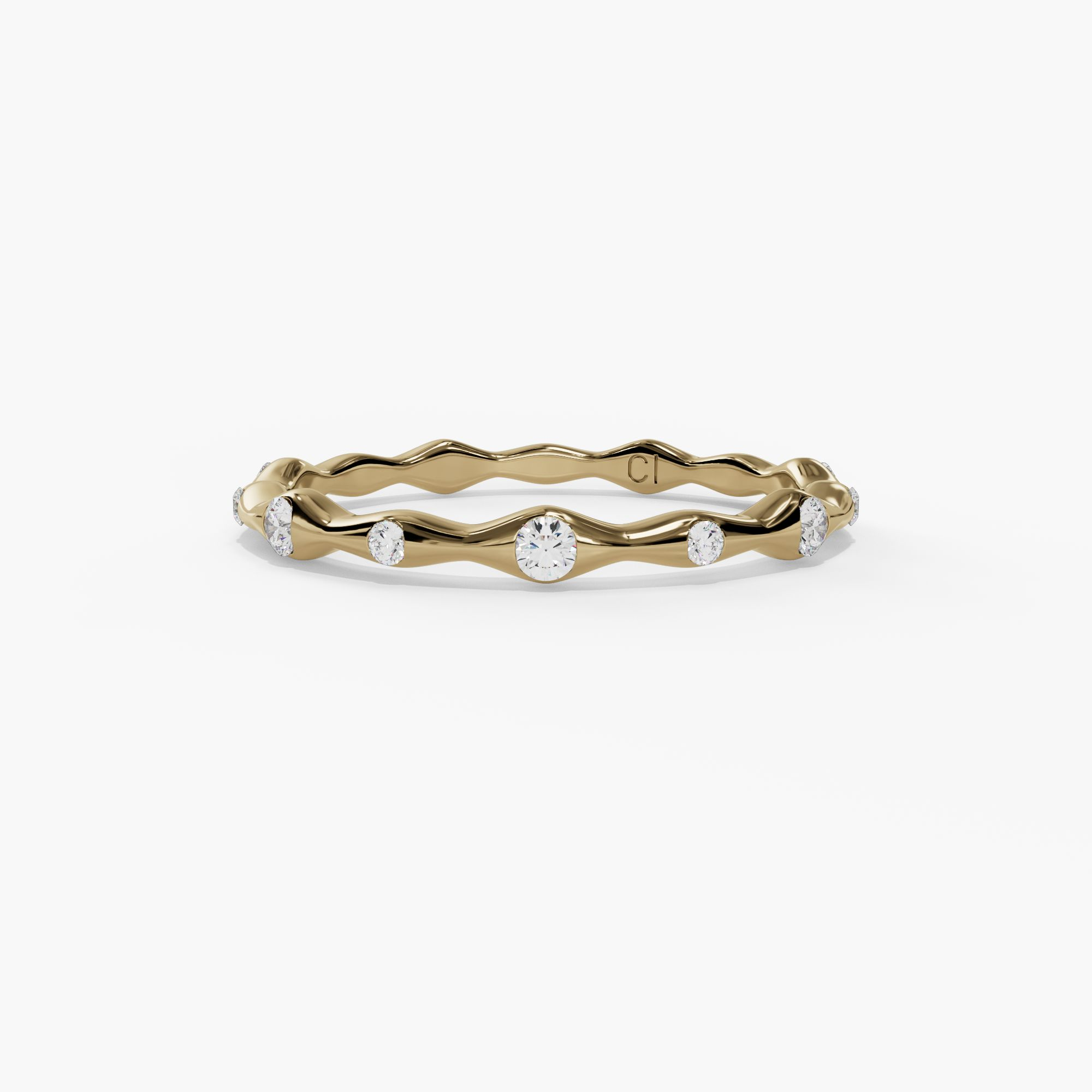 Thin yellow gold wavy ring with bezel set round natural diamonds
