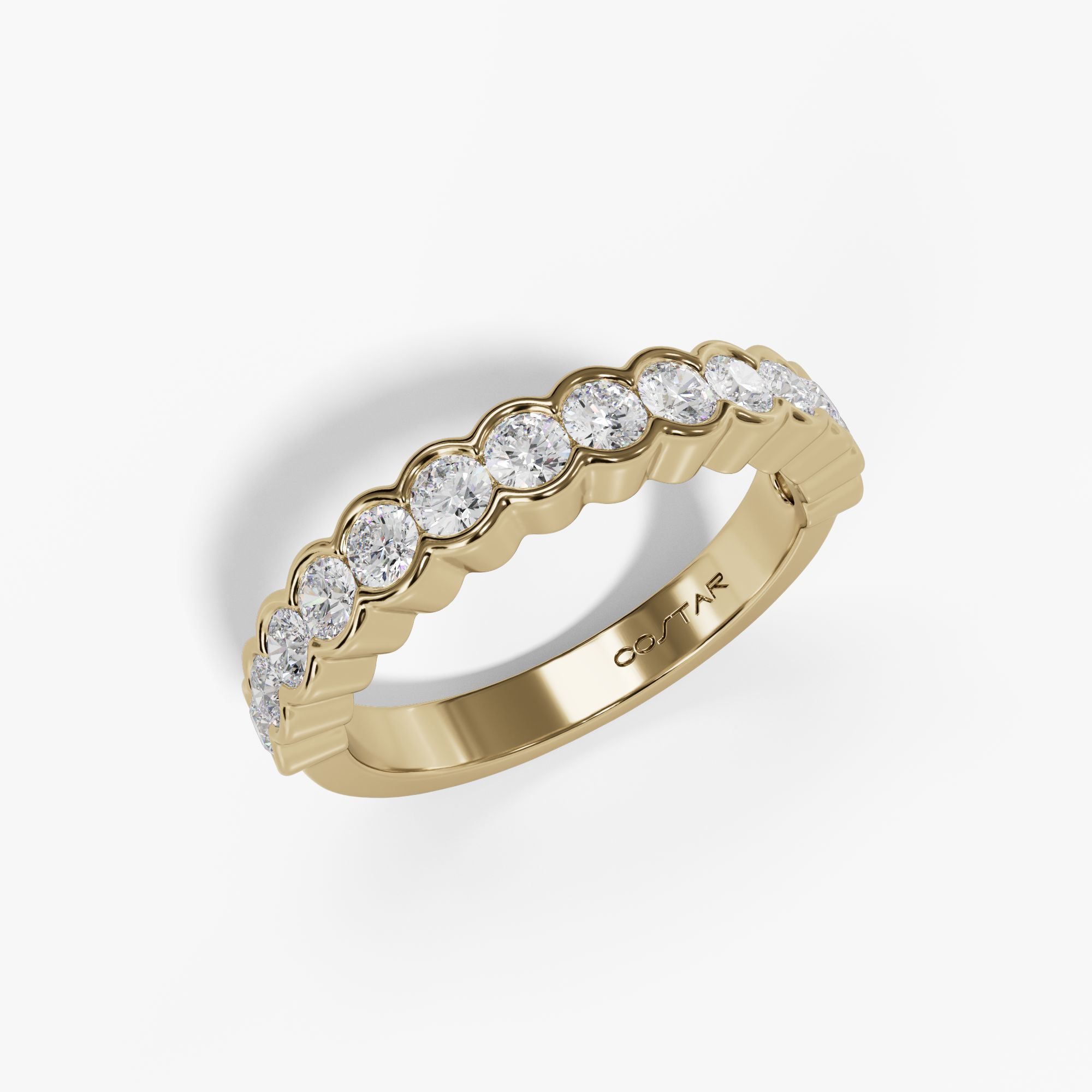 Bezel-set scalloped diamond band in yellow gold, angled view